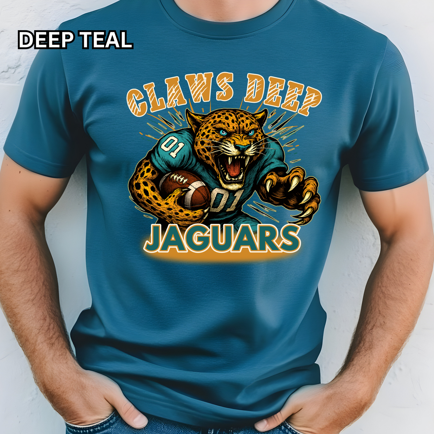 Blue t-shirt with a jaguar graphic and text on a plain background Jaguars Football Graphic Tee: Claw Deep Jaguars Game Day Comfy T-Shirt