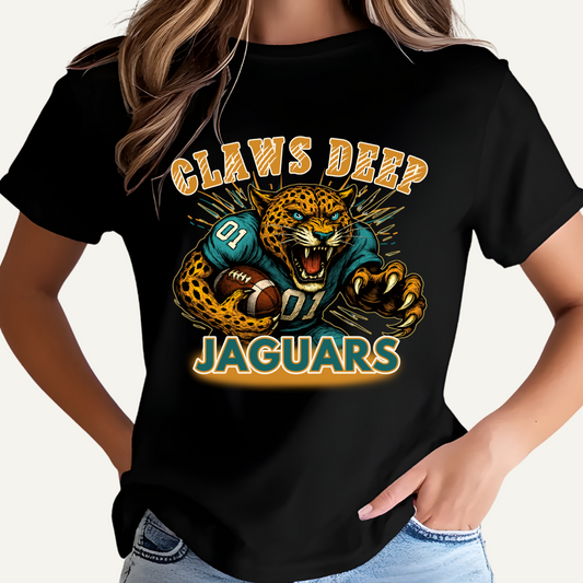 Person wearing a black t-shirt with a Jaguars graphic and text on a yellow background Jaguars Football Graphic Tee: Claw Deep Jaguars Game Day Comfy T-Shirt