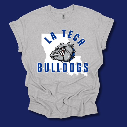 A light heather gray t-shirt featuring a 'LA Tech Bulldogs' graphic on the front, displayed against a solid dark blue background.