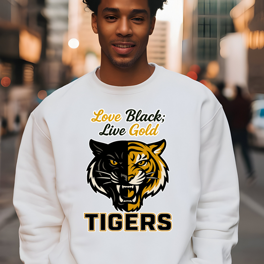 Person wearing a white sweatshirt with a tiger design and text in an urban setting Grambling Tigers Sweater: Love Black; Live Gold Unisex Bold Crewneck Sweater