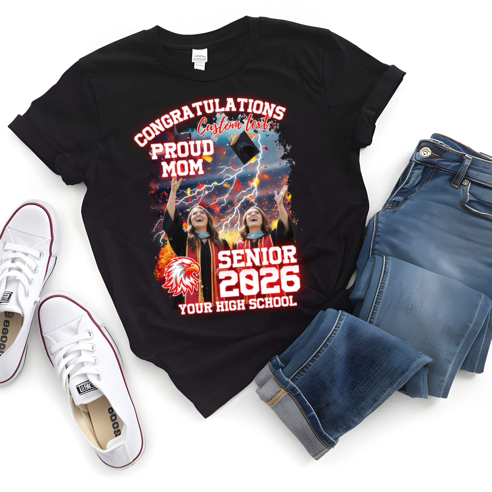 Black t-shirt with graduation design, white sneakers, and blue jeans on a white background  Customizable graduation photo t-shirt featuring senior portrait, school mascot, and sports organization logos in school colors