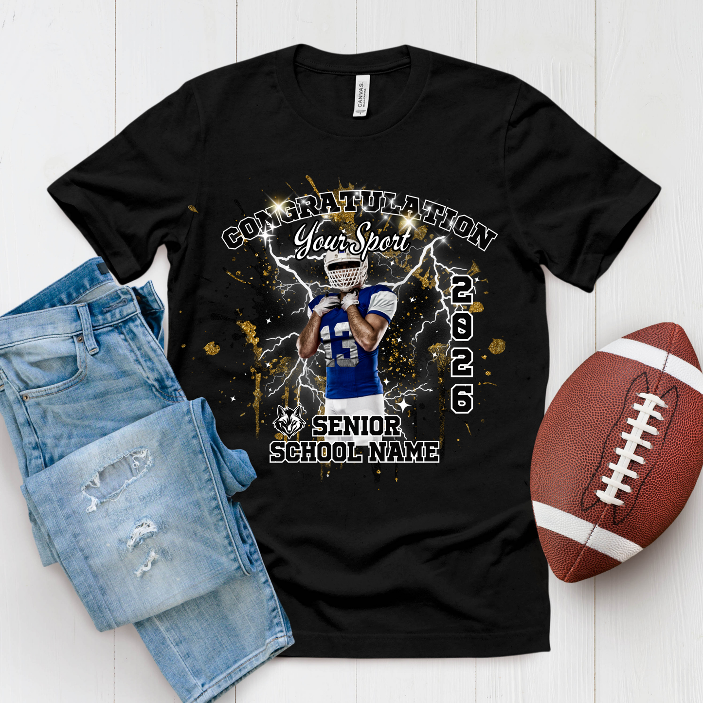 Black t-shirt with football design, denim shorts, and football on a white background