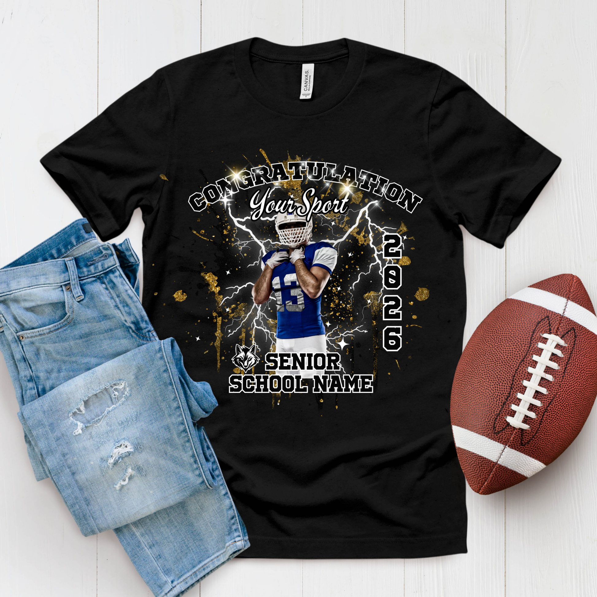 Black t-shirt with football design, denim shorts, and football on a white background