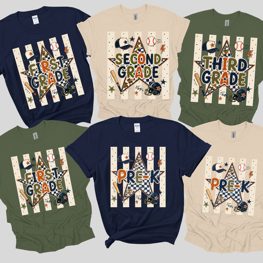 Six baseball-themed graphic t-shirts in navy blue, olive green, and beige, arranged in a grid. Each shirt features a unique design with the text 'First Grade', 'Second Grade', 'Third Grade', or 'Pre-K' styled inside a star over vertical white baseball stripes, decorated with sports elements like baseballs, bats, helmets, and a baseball bat.