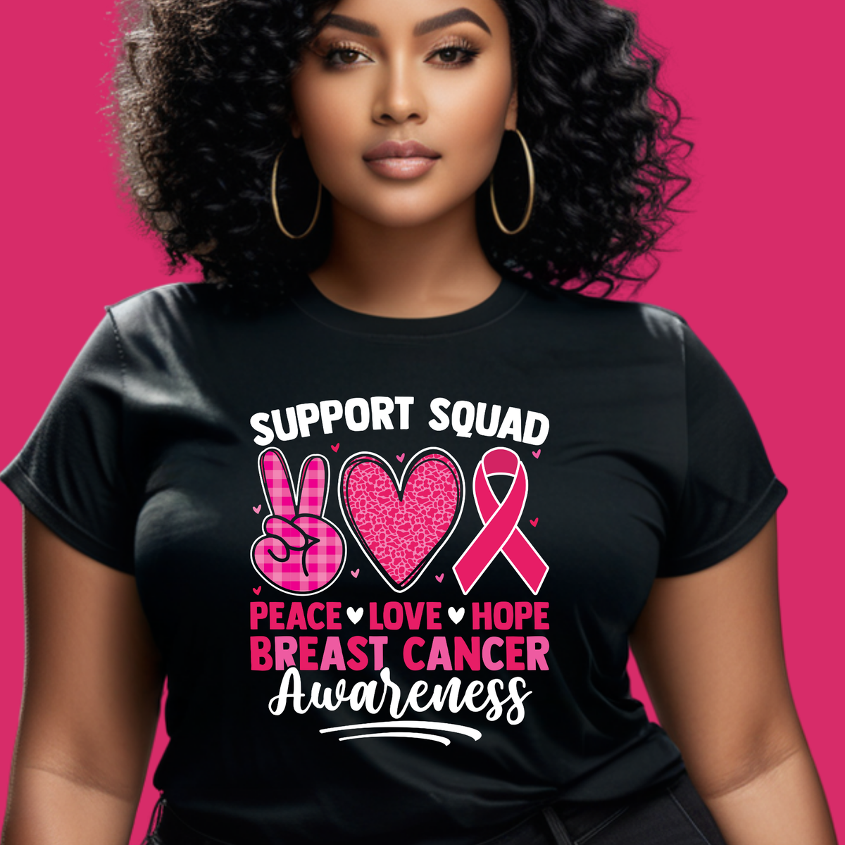 Woman wearing a black t-shirt with pink breast cancer awareness design on a pink background Pink Ribbon T-Shirt: Support Squad Peace Love Hope -  Support Tee