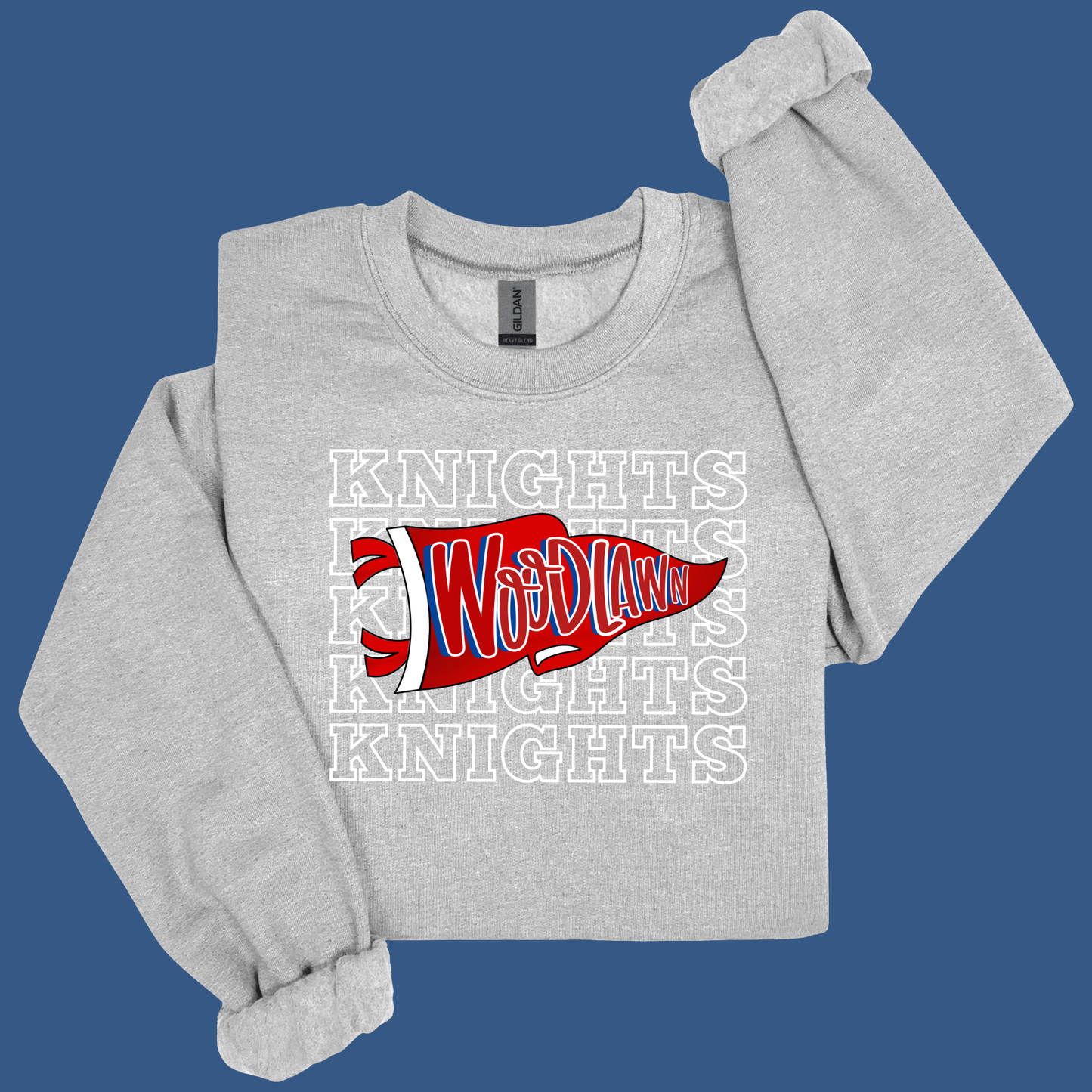 A light heather gray long-sleeve t-shirt with a red and white 'WhodLaw' graphic and white 'KNIGHTS' text, displayed on a solid blue background.