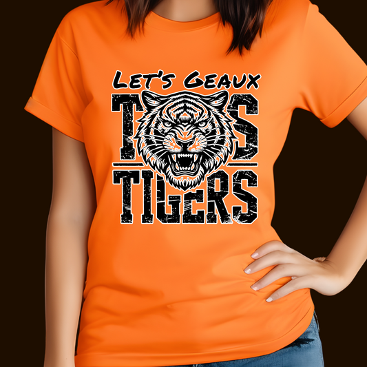 Person wearing an orange t-shirt with a tiger graphic and text on a dark background Let's Geaux Tigers T-Shirt - Fierce Tiger Graphic Game Day Tee