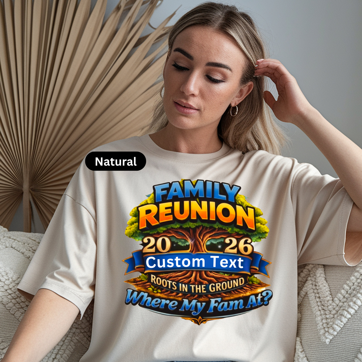 Woman wearing a white t-shirt with a colorful 'Family Reunion' design.
