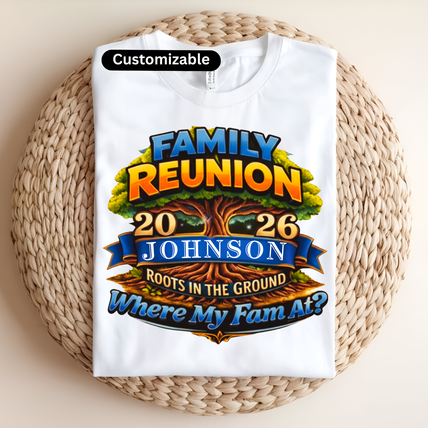 White t-shirt with colorful 'Family Reunion' design on a woven surface