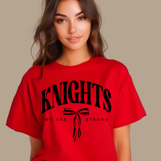 Person wearing a red t-shirt with 'KNIGHTS WE ARE STRONG' text on a beige background Knights School Spirit Shirt - Knights We  Are Strong - Knights Spirit Tee