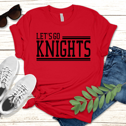Red t-shirt with 'Let's Go Knights' text, sunglasses, white sneakers, and jeans on a wooden surface. Knights School Spirit Shirt - Let's Go Knights - Knights Spirit Tee