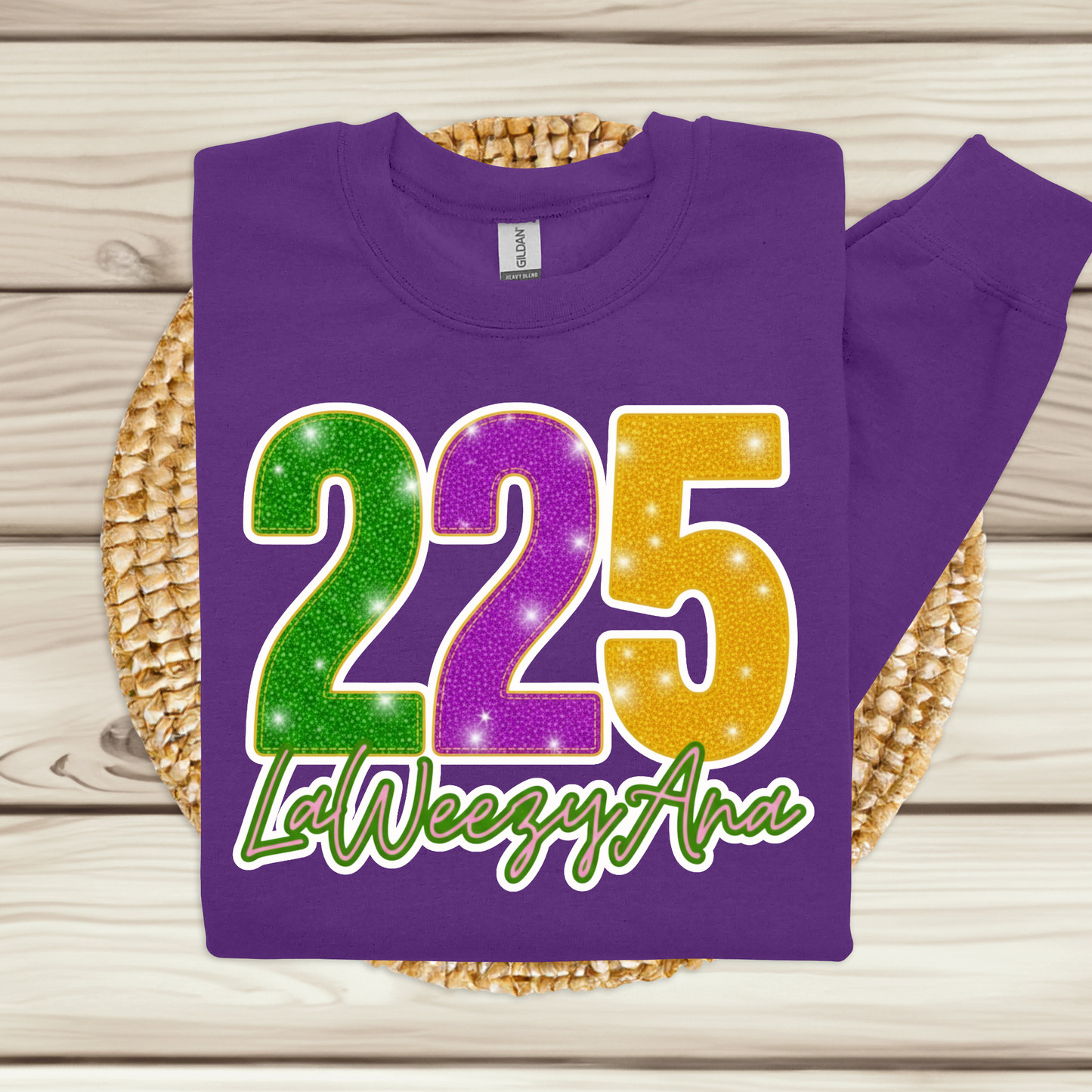 Purple shirt with colorful numbers and text on a woven mat