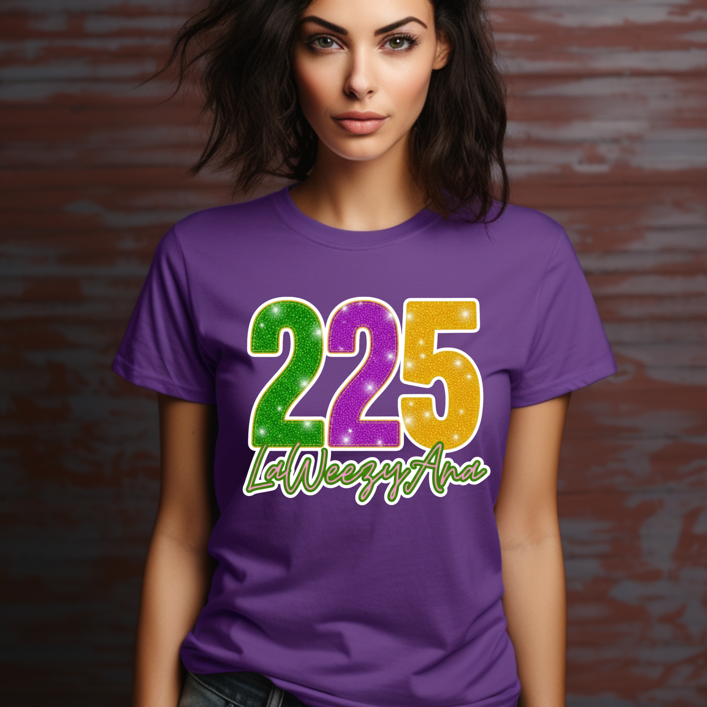 Woman wearing a purple t-shirt with colorful numbers and text against a brick wall.