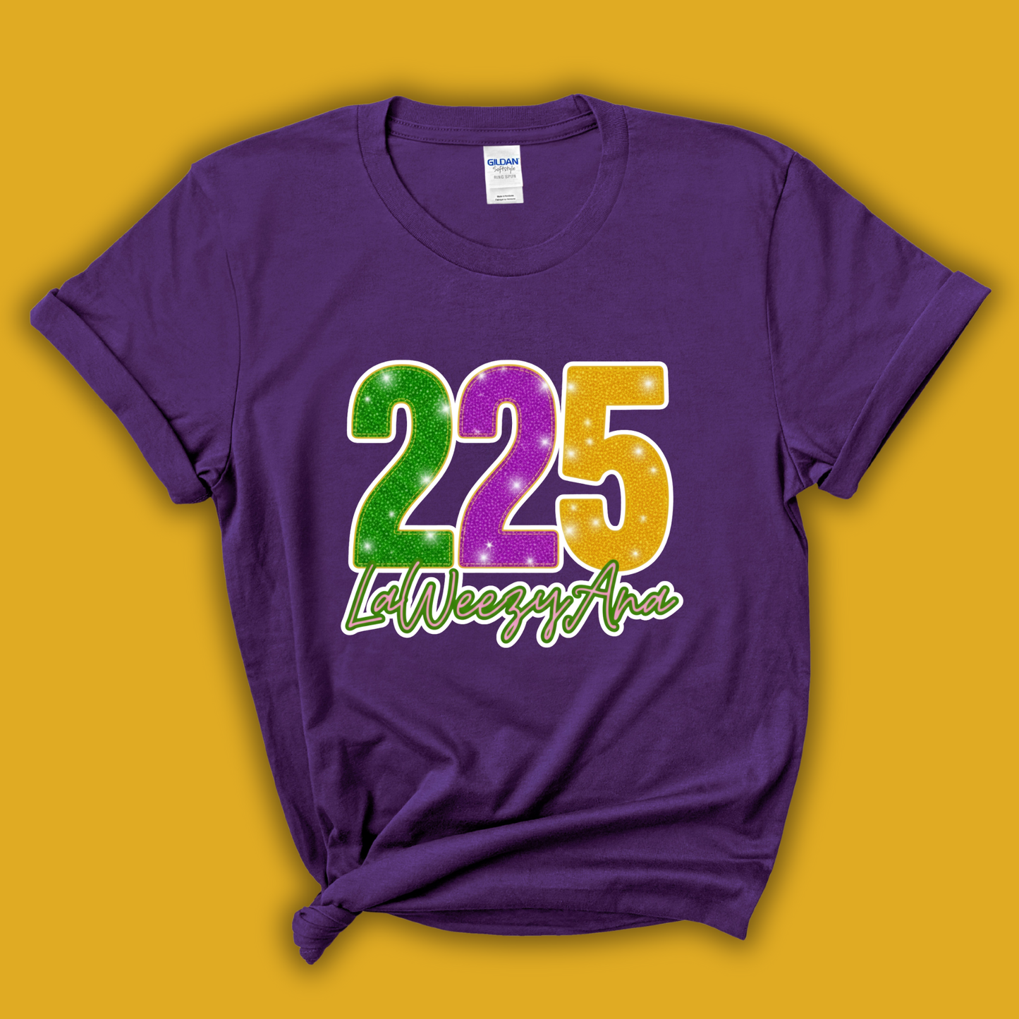 Purple t-shirt with colorful '225 LaWeezy Ana' design on a yellow background