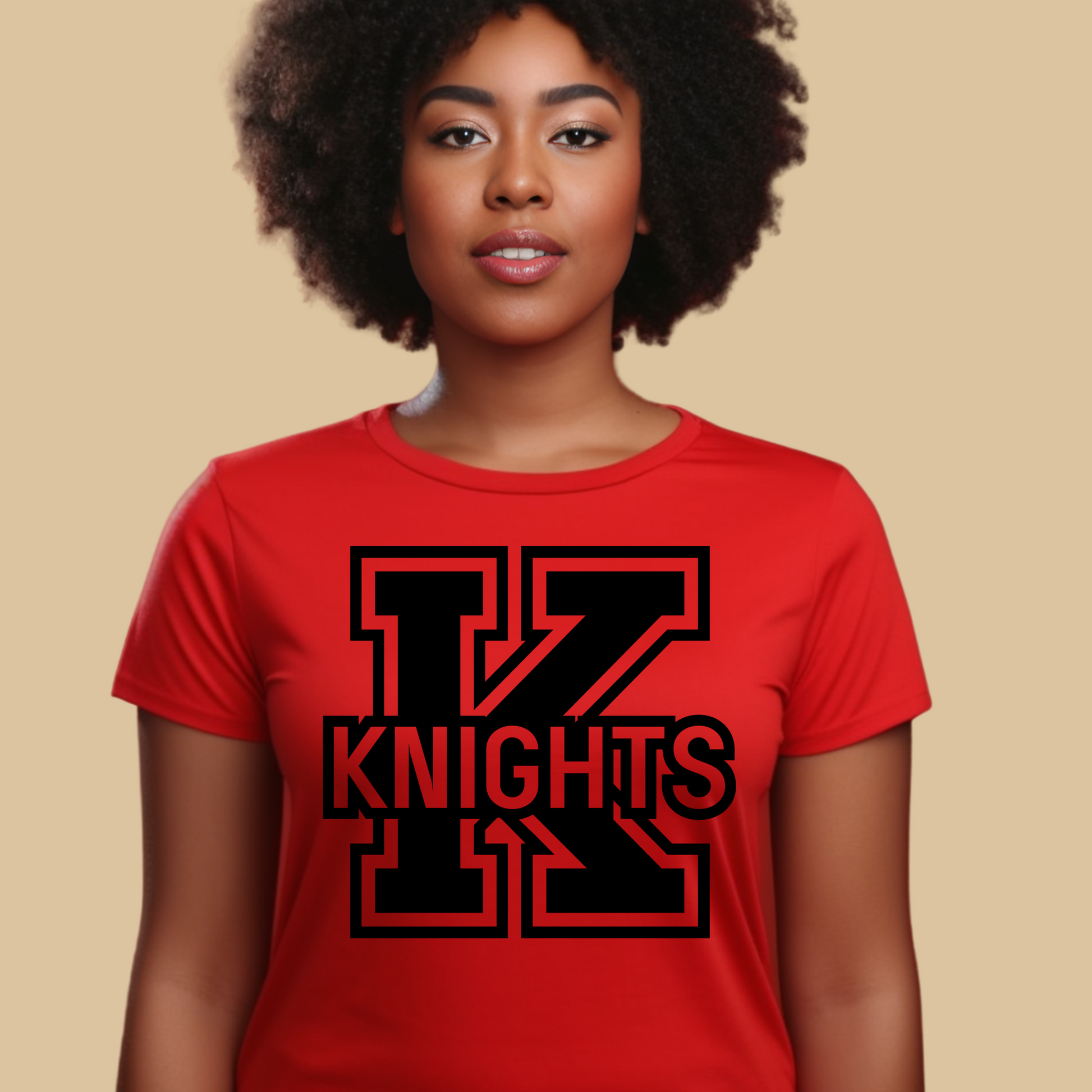 Person wearing a red t-shirt with 'K KNIGHTS' design on a beige background Knights School Spirit Shirt - Knights Logo: Loud & Proud Knights