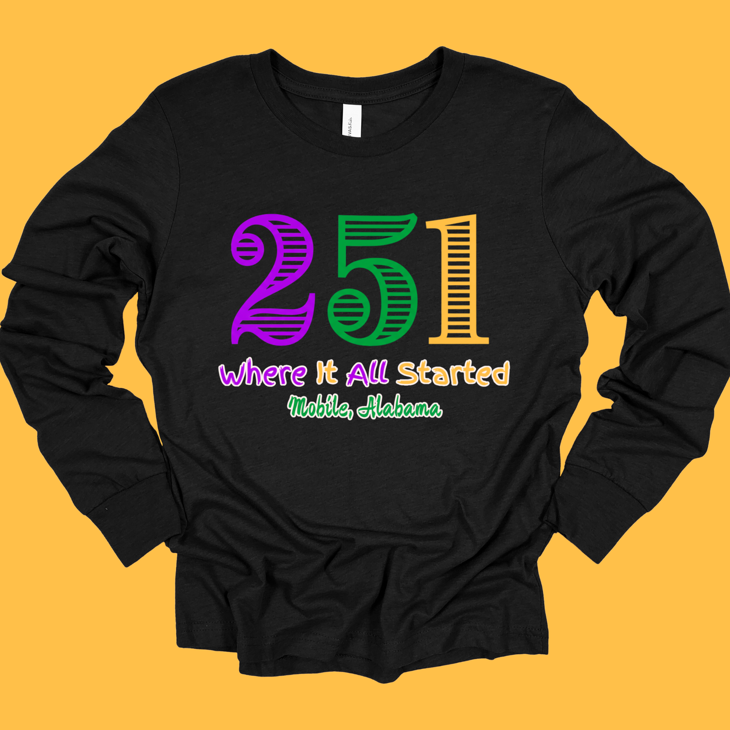 Black long-sleeve shirt with colorful text on a yellow background