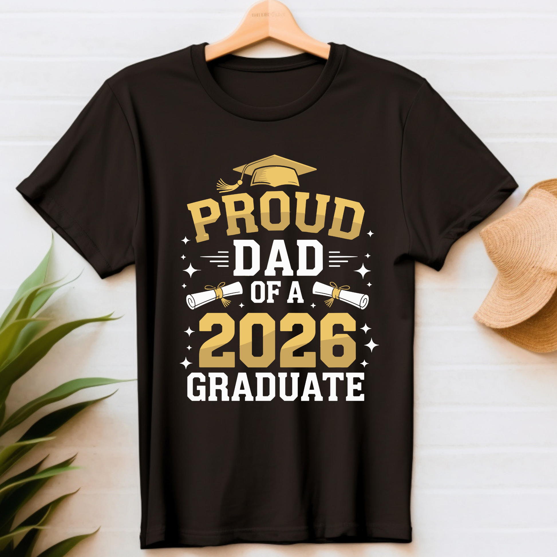 Black t-shirt with 'Proud Dad of a 2026 Graduate' text on a white background