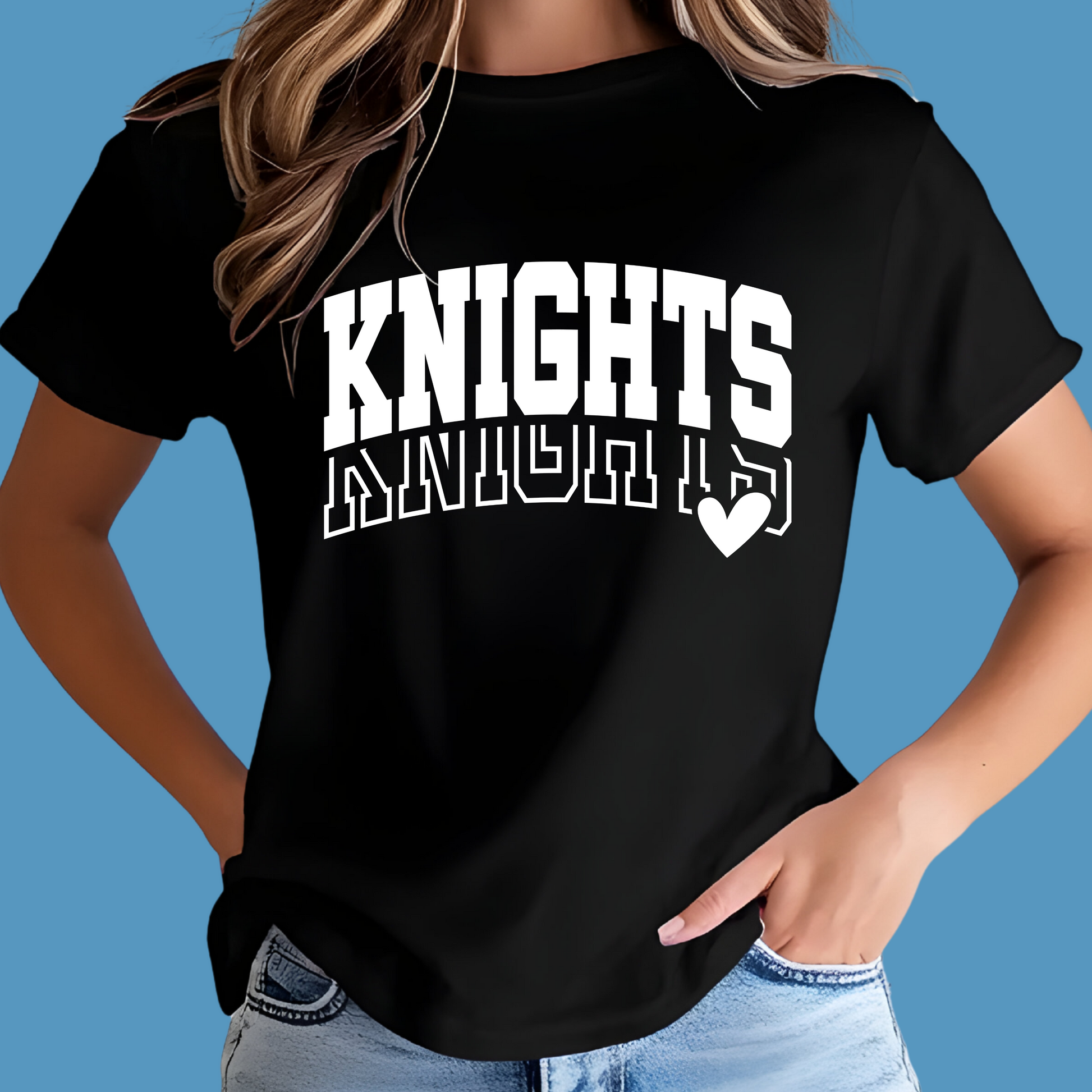 Person wearing a black t-shirt with 'KNIGHTS' printed on it against a blue background  Knights School Spirit Shirt - Knights Varsity - Knights Spirit Tee