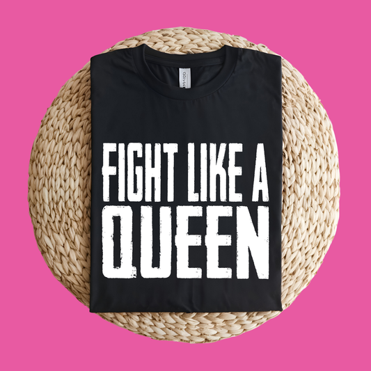 Black t-shirt with 'Fight Like a Queen' text on a woven mat against a pink background Pink Ribbon Tee: FIGHT LIKE A QUEEN - Powerful Empowerment T-shirt