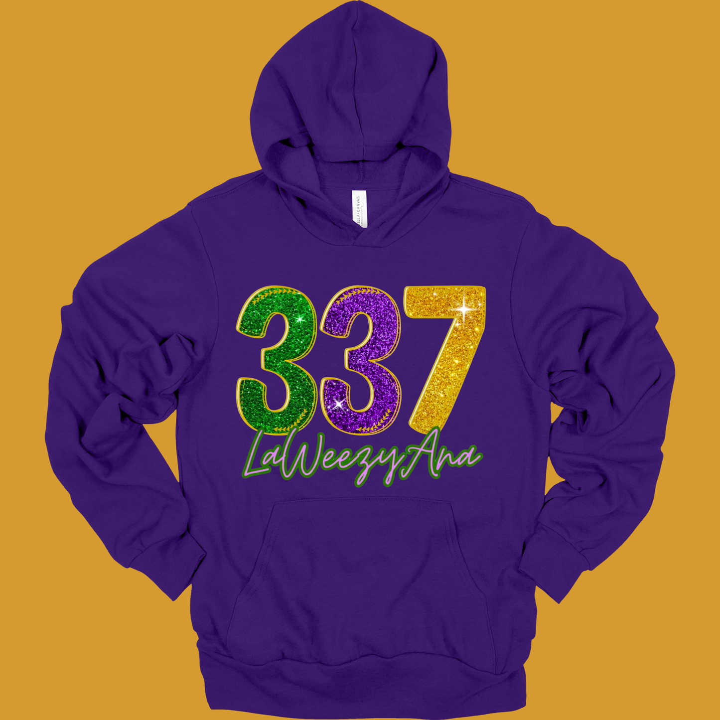 Purple hoodie with glittery numbers '337' and text on a mustard yellow background