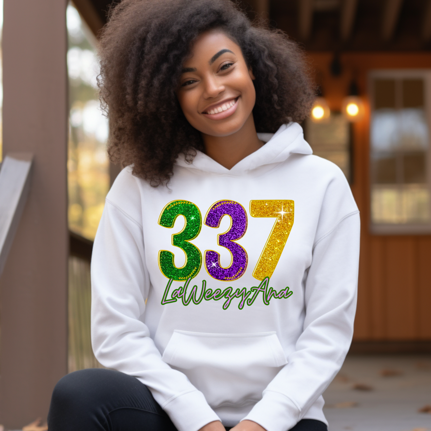 Person wearing a white hoodie with colorful numbers and text