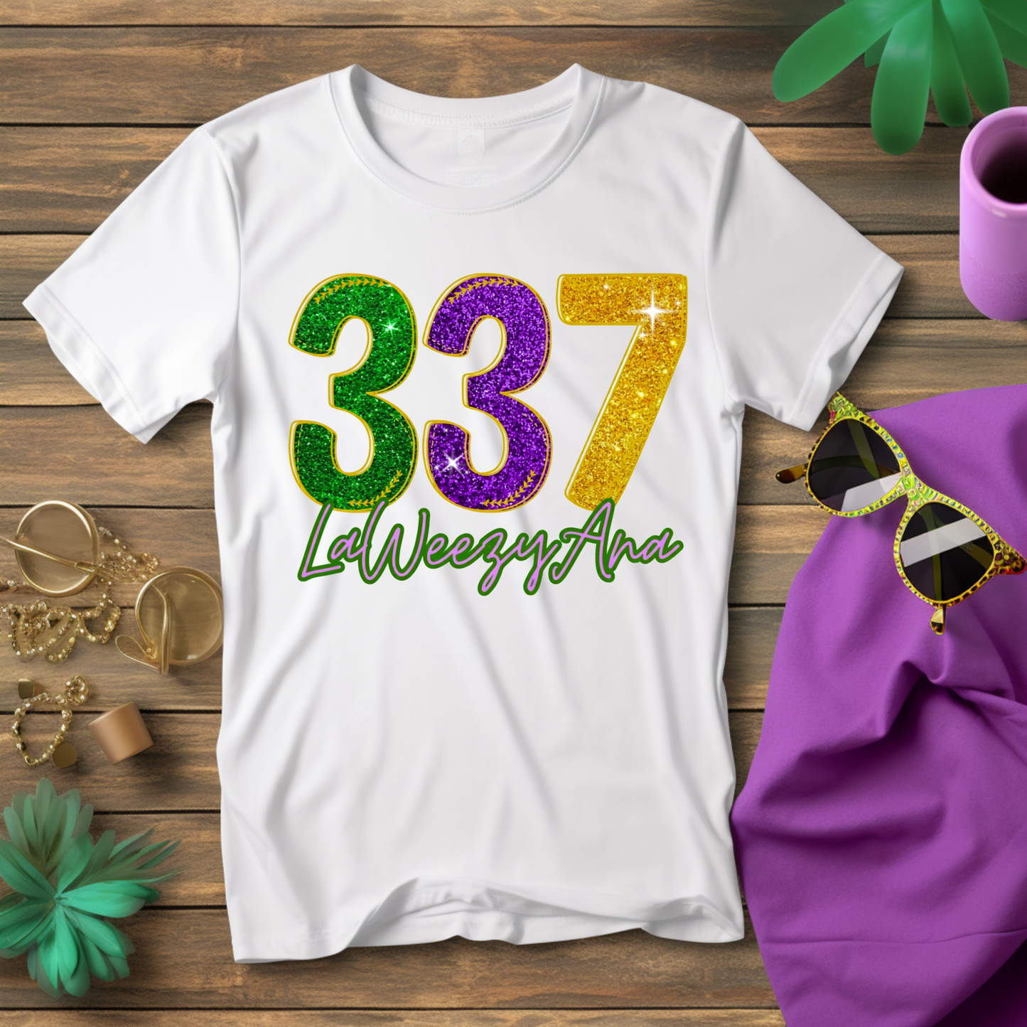 White t-shirt with colorful numbers and text on a wooden surface with accessories.
