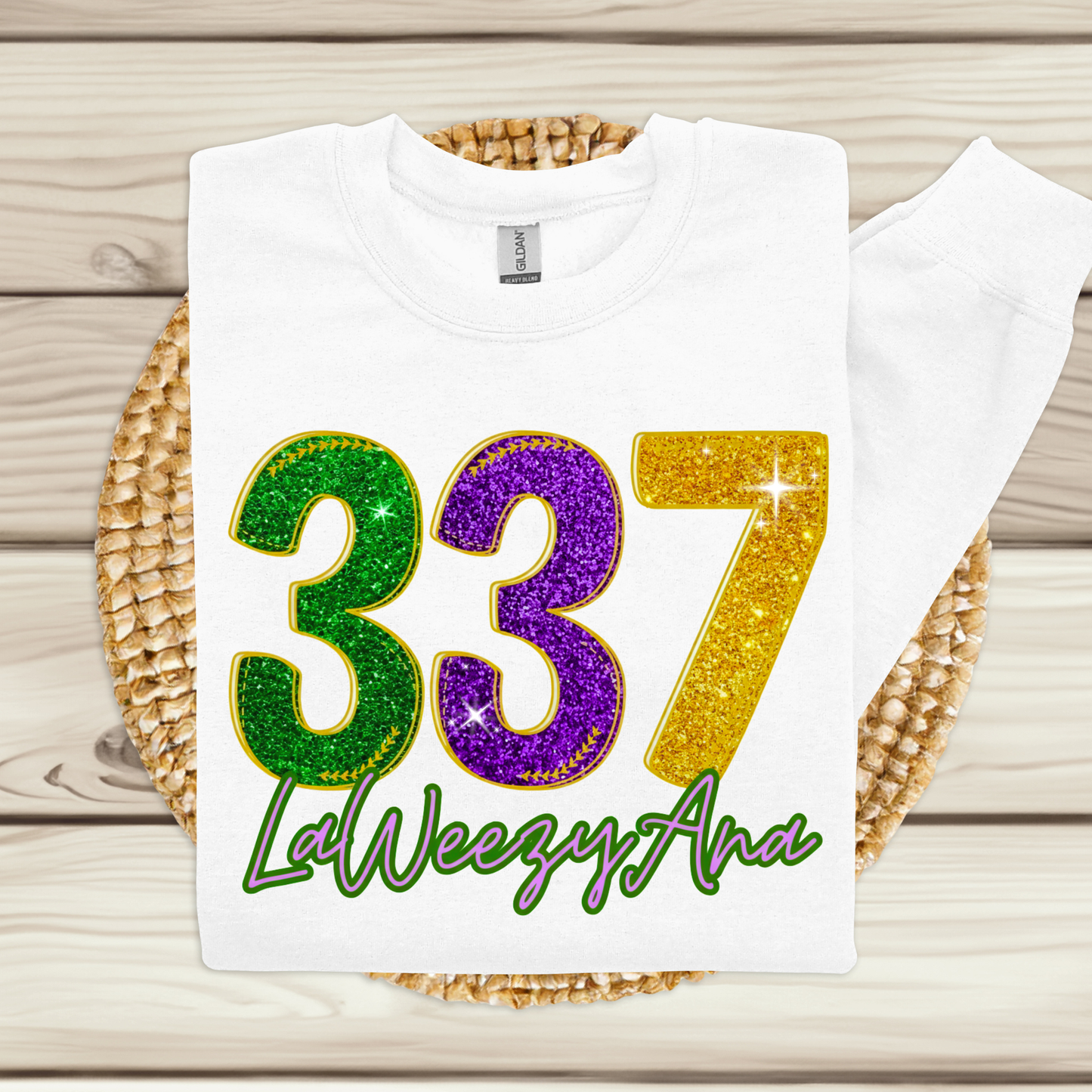 White t-shirt with colorful numbers and text on a woven mat