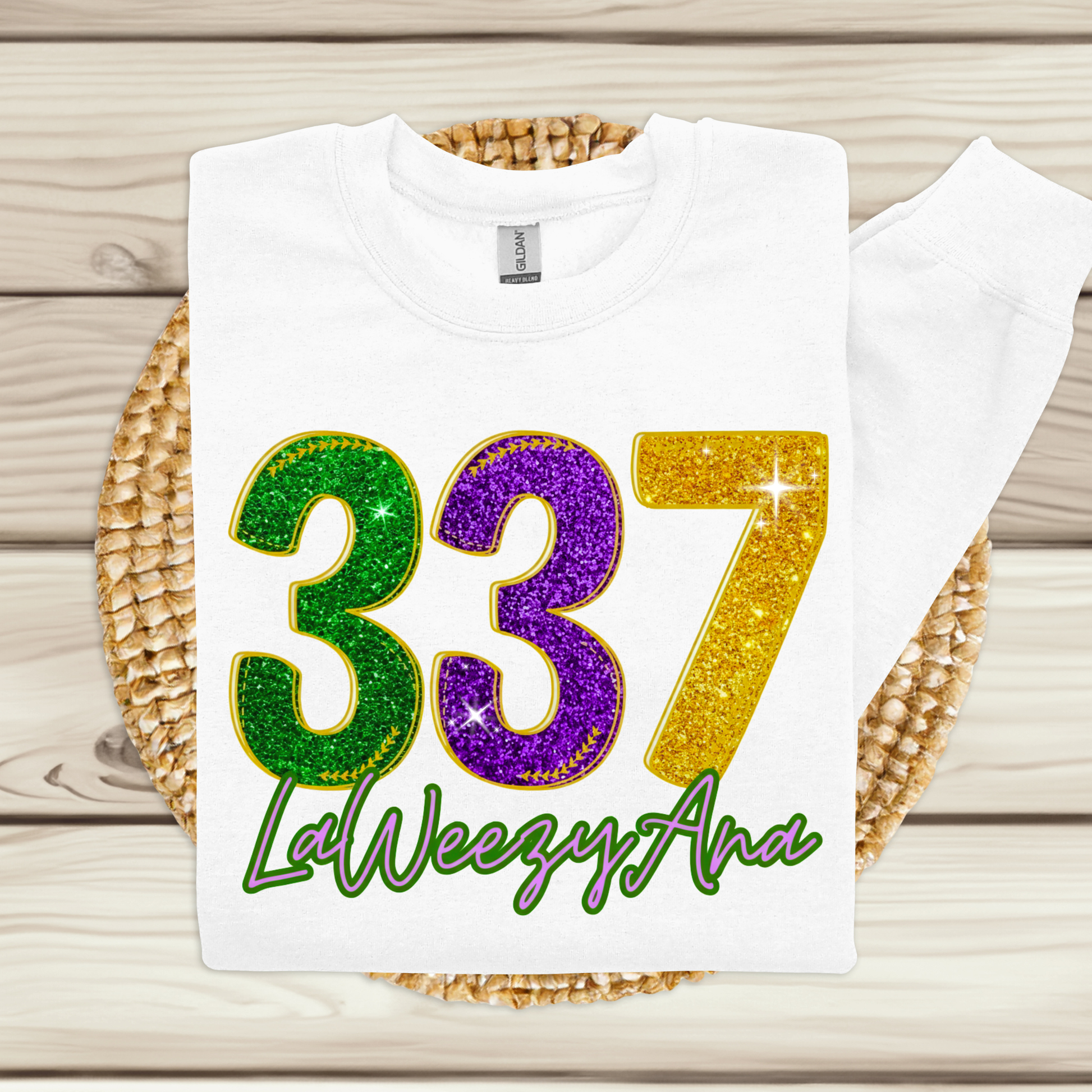 White t-shirt with colorful numbers and text on a woven mat