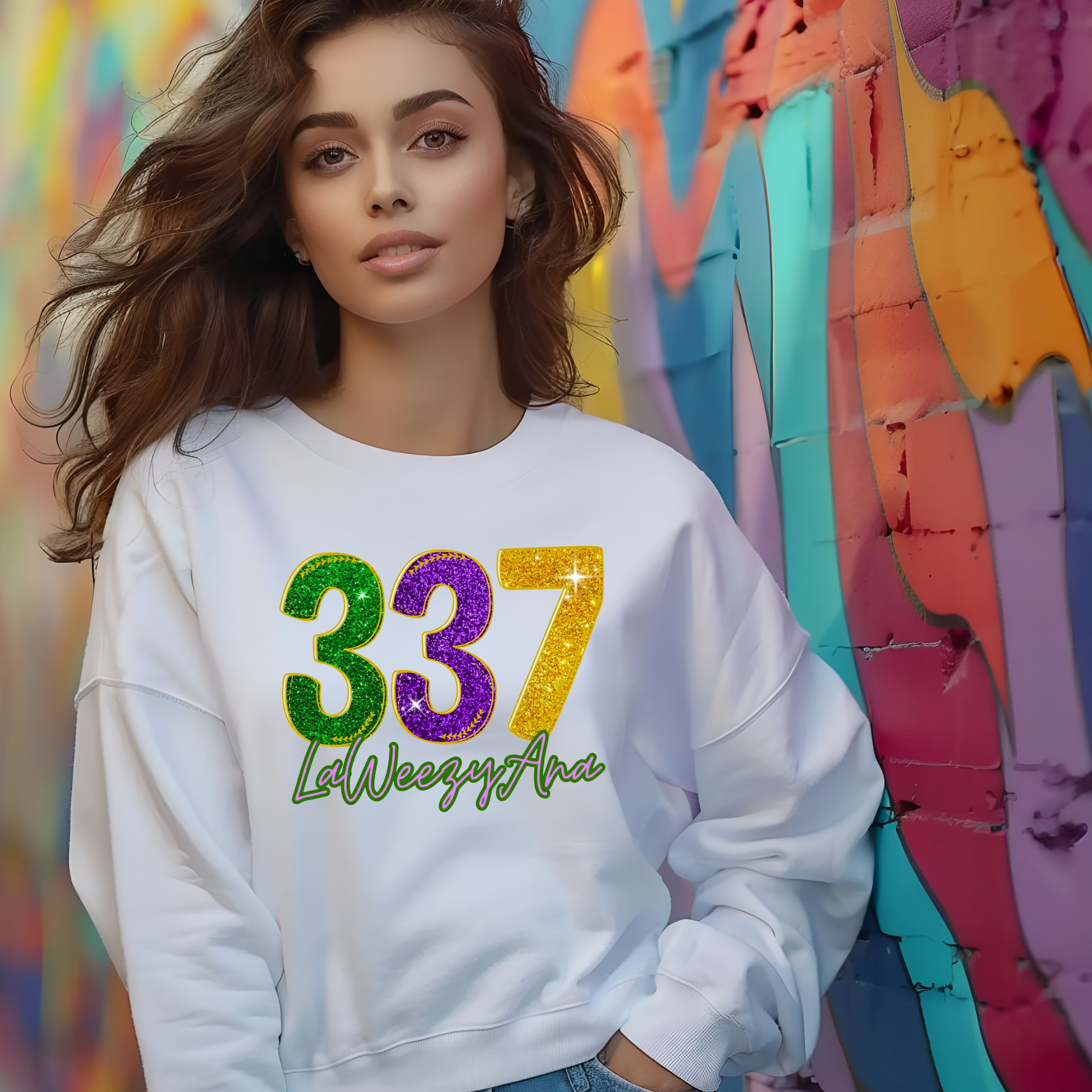 Woman wearing a white sweatshirt with colorful numbers and text against a multicolored abstract background