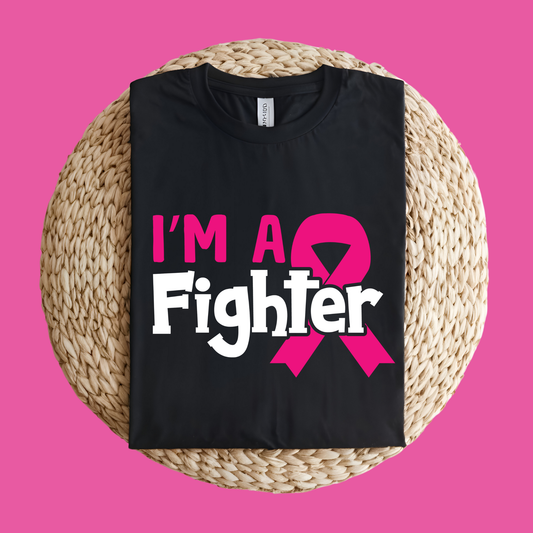 Black t-shirt with 'I'm a Fighter' and pink ribbon design on a pink background  Pink Ribbon Tee: I'M A FIGHTER - Powerful Empowerment T-shirt