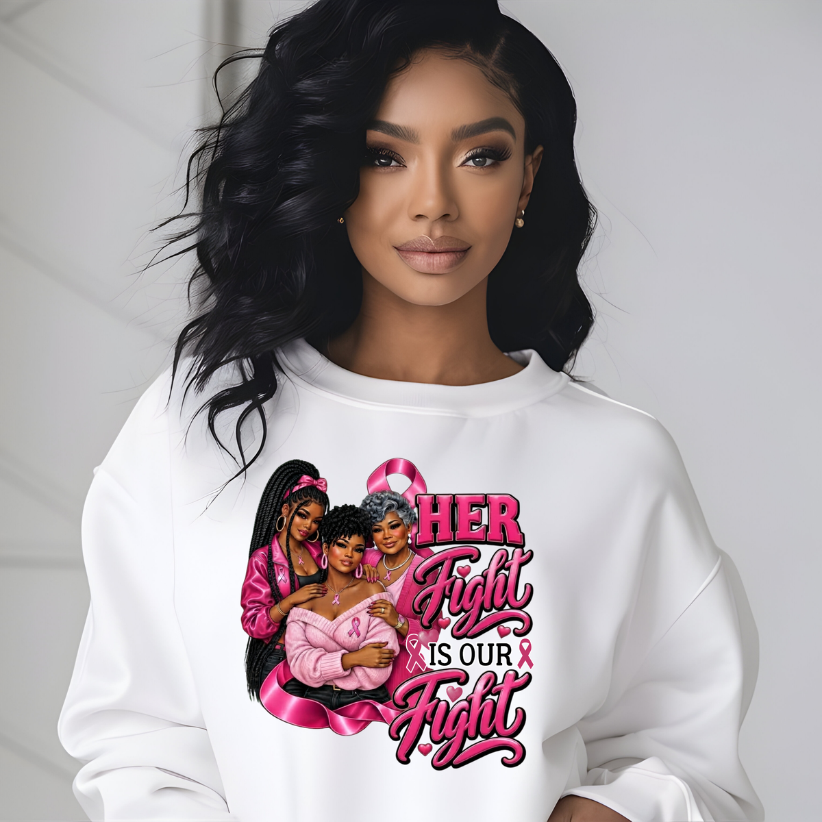 A woman wearing a white crewneck sweatshirt with a pink and black graphic print that reads 'HER Fight IS OUR Fight' alongside three illustrated women and pink awareness ribbon motifs, set against a light gray background.