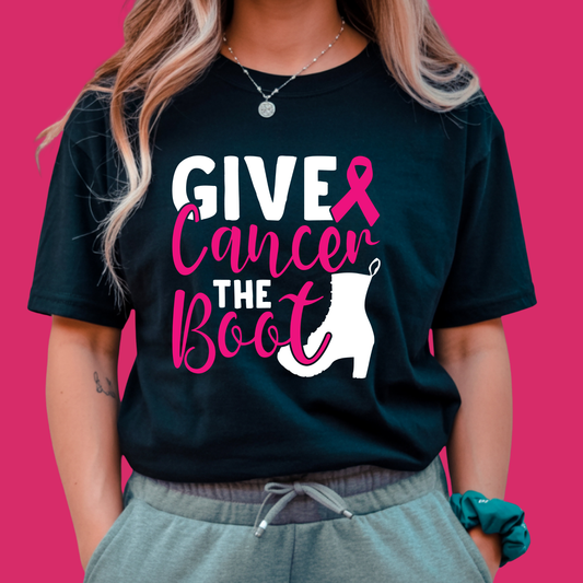Person wearing a black t-shirt with 'Give Cancer the Boot' design on a pink background Pink Ribbon Tee: GIVE CANCER THE BOOT- Powerful Awareness Support T-shirt