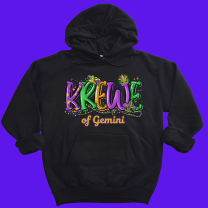 Black hoodie with colorful 'Krew of Gemini' text on a purple background