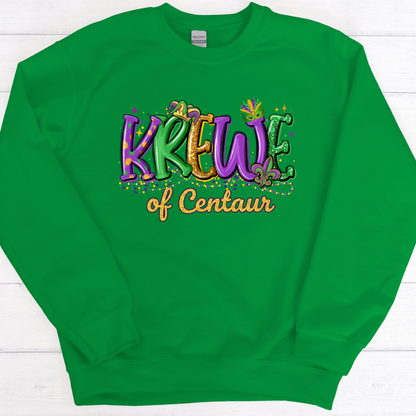 Green sweatshirt with colorful text 'Krew of Centaur' on a white wooden background