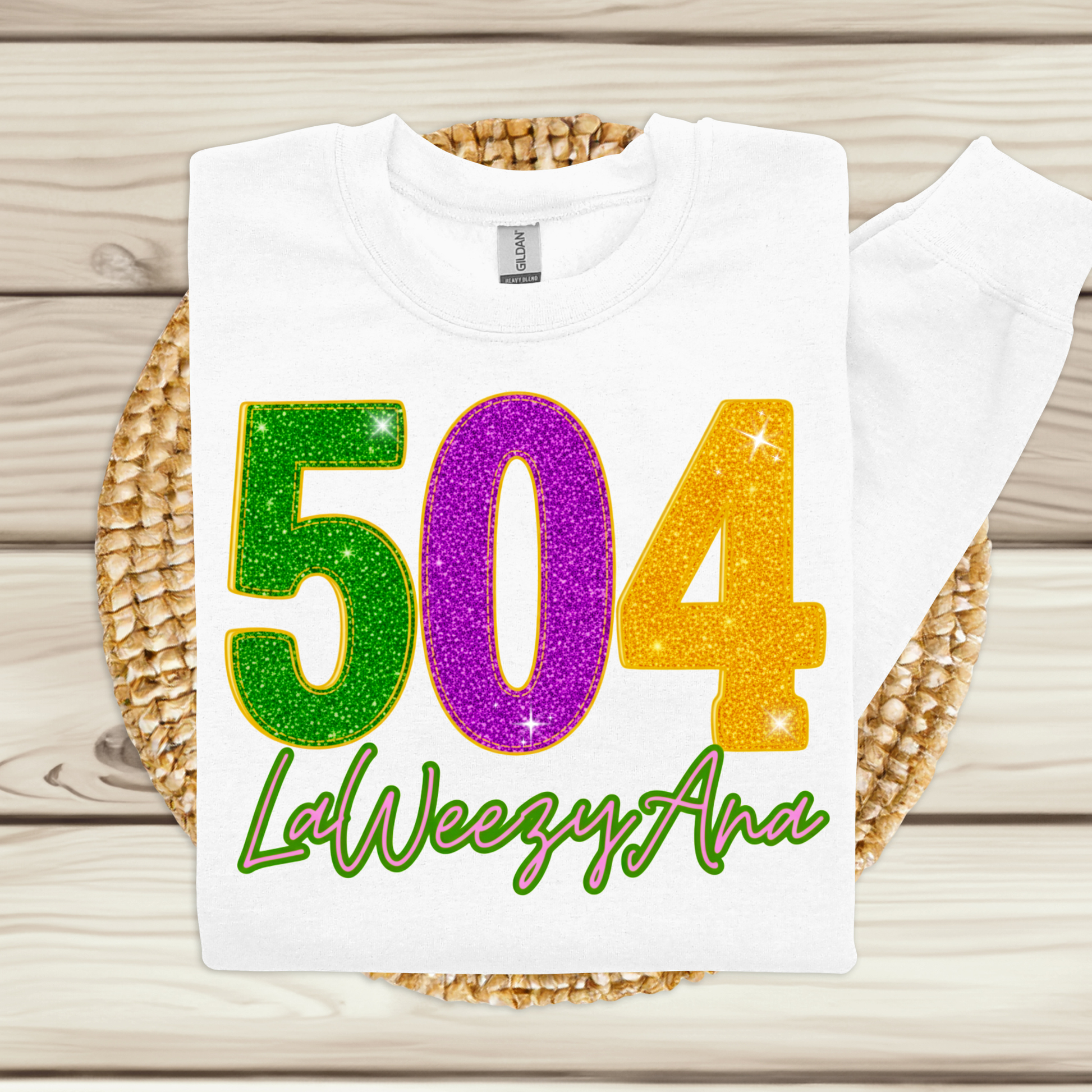 White t-shirt with colorful numbers '504' and text on a woven mat