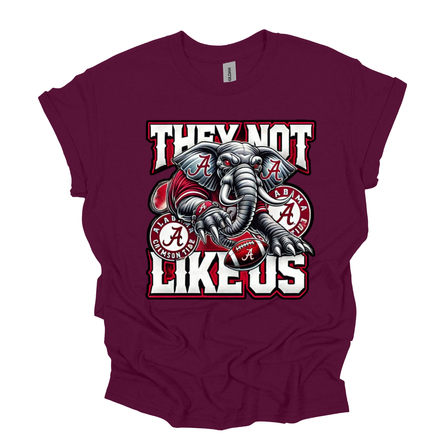 A maroon short-sleeve t-shirt with a graphic of an Alabama Crimson Tide elephant and the text 'THEY NOT LIKE US' in white and red.