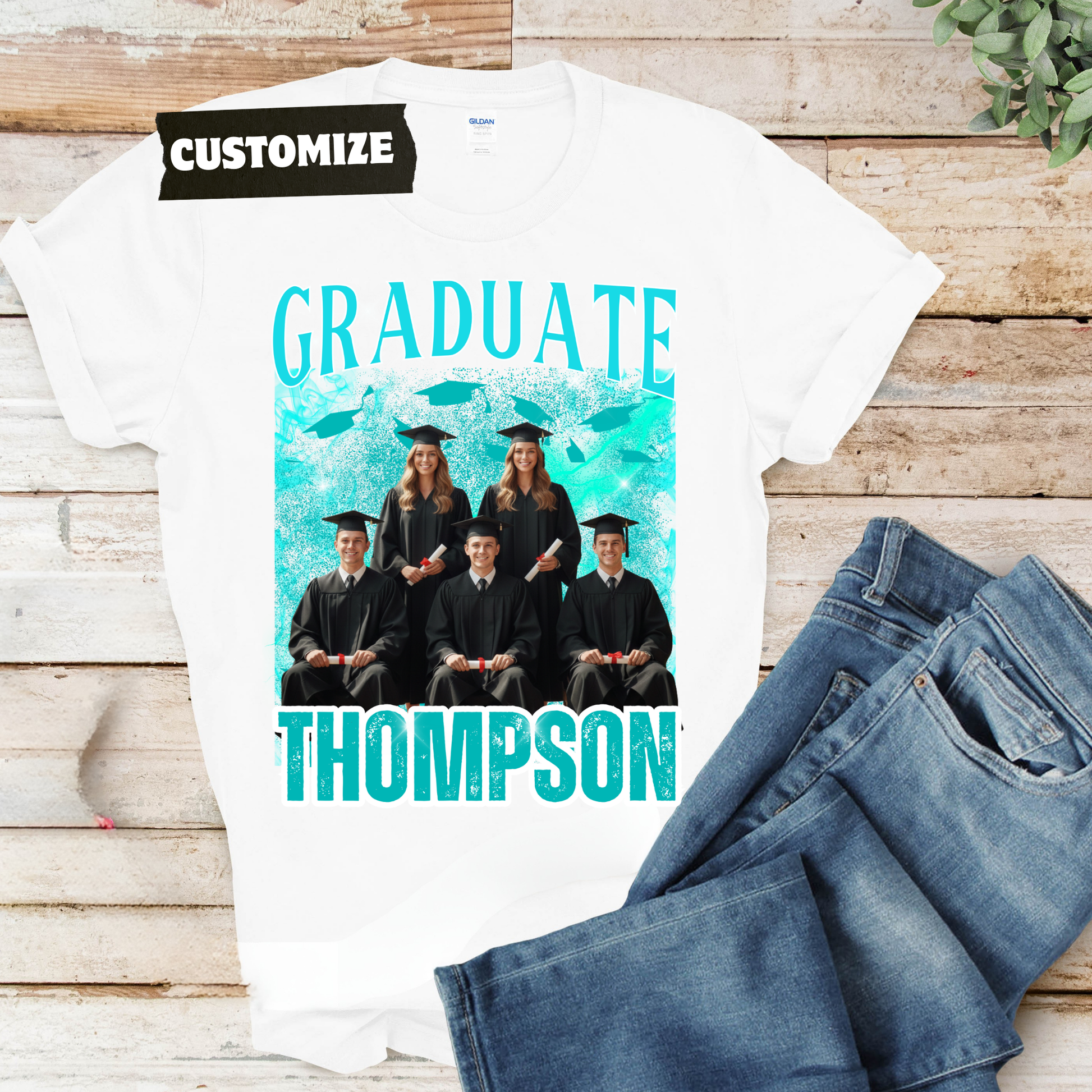 White t-shirt with graduation design and jeans on a wooden surface  Customizable graduation photo t-shirt featuring senior portrait, school mascot, and sports organization logos in school colors