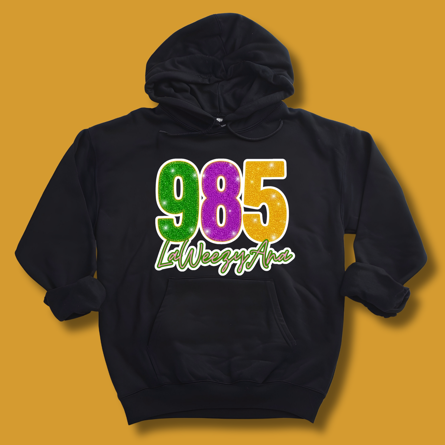 Black hoodie with colorful text on a yellow background