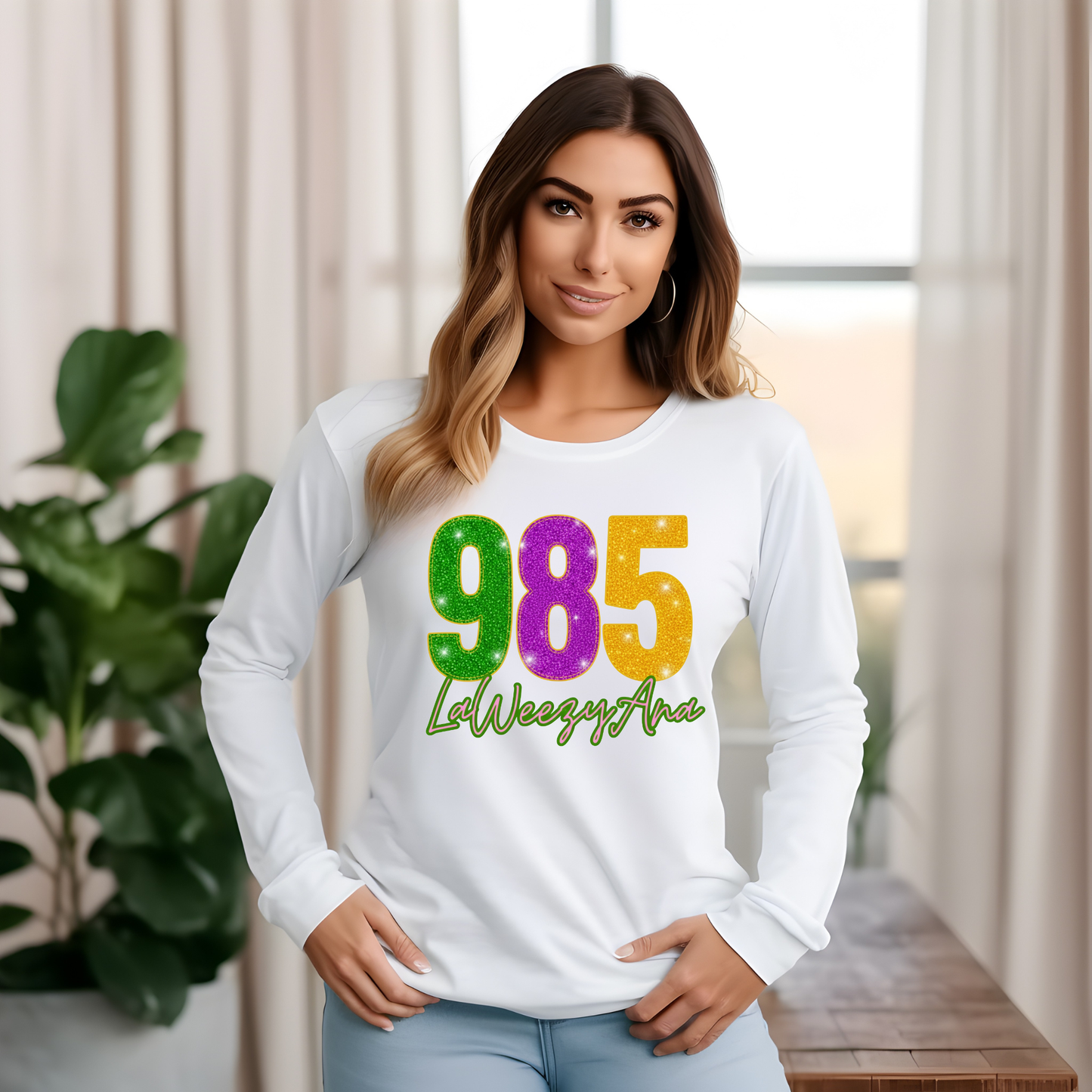 Woman wearing a white long-sleeve shirt with colorful text in a home setting