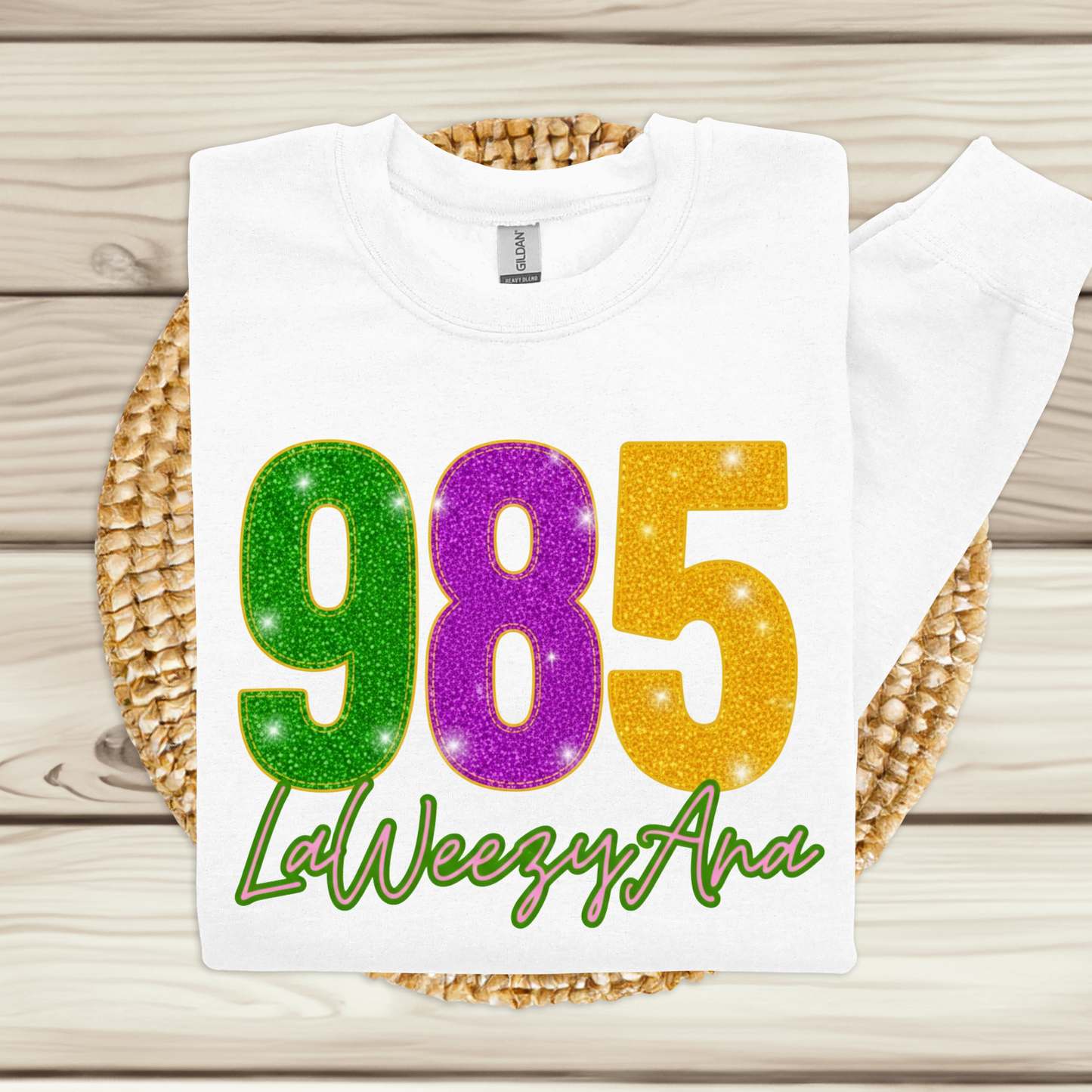 White t-shirt with colorful numbers and text on a woven mat