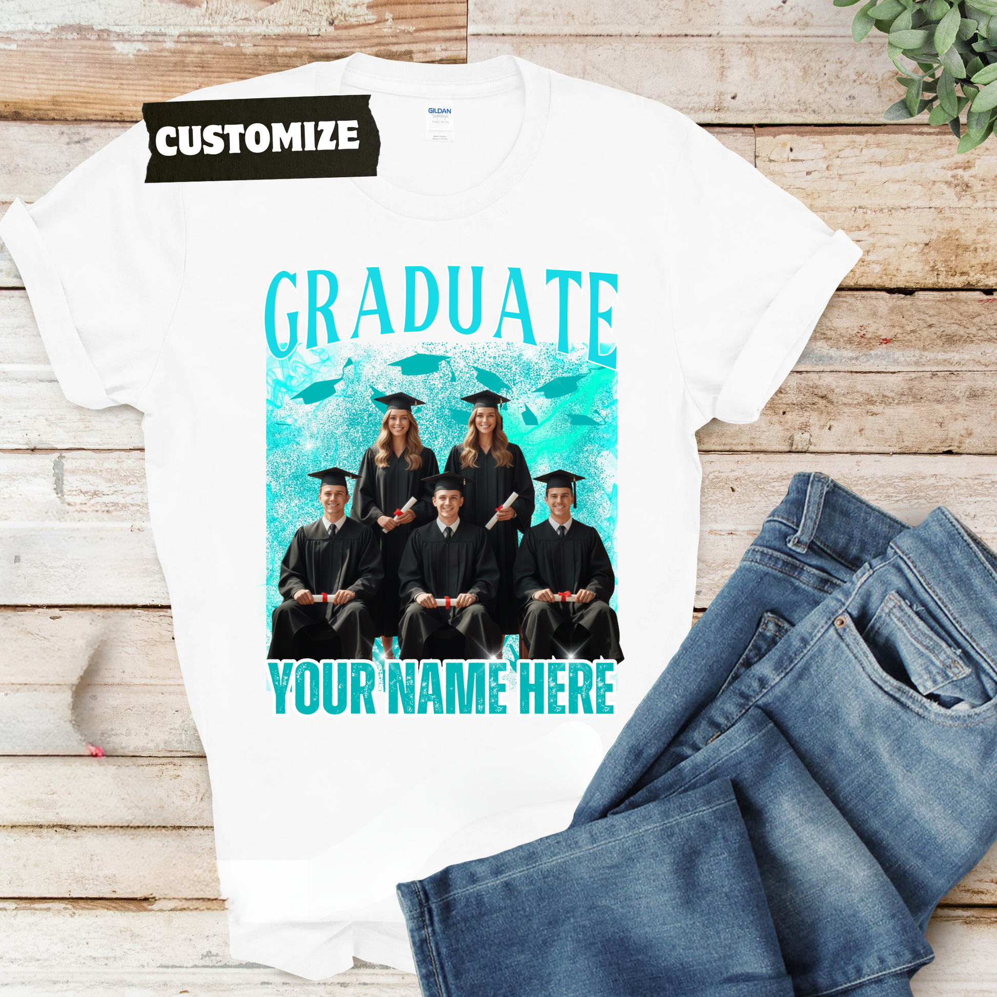 Graduation-themed customizable t-shirt with a photo of graduates and space for text on a wooden surface.  Customizable graduation photo t-shirt featuring senior portrait, school mascot, and sports organization logos in school colors