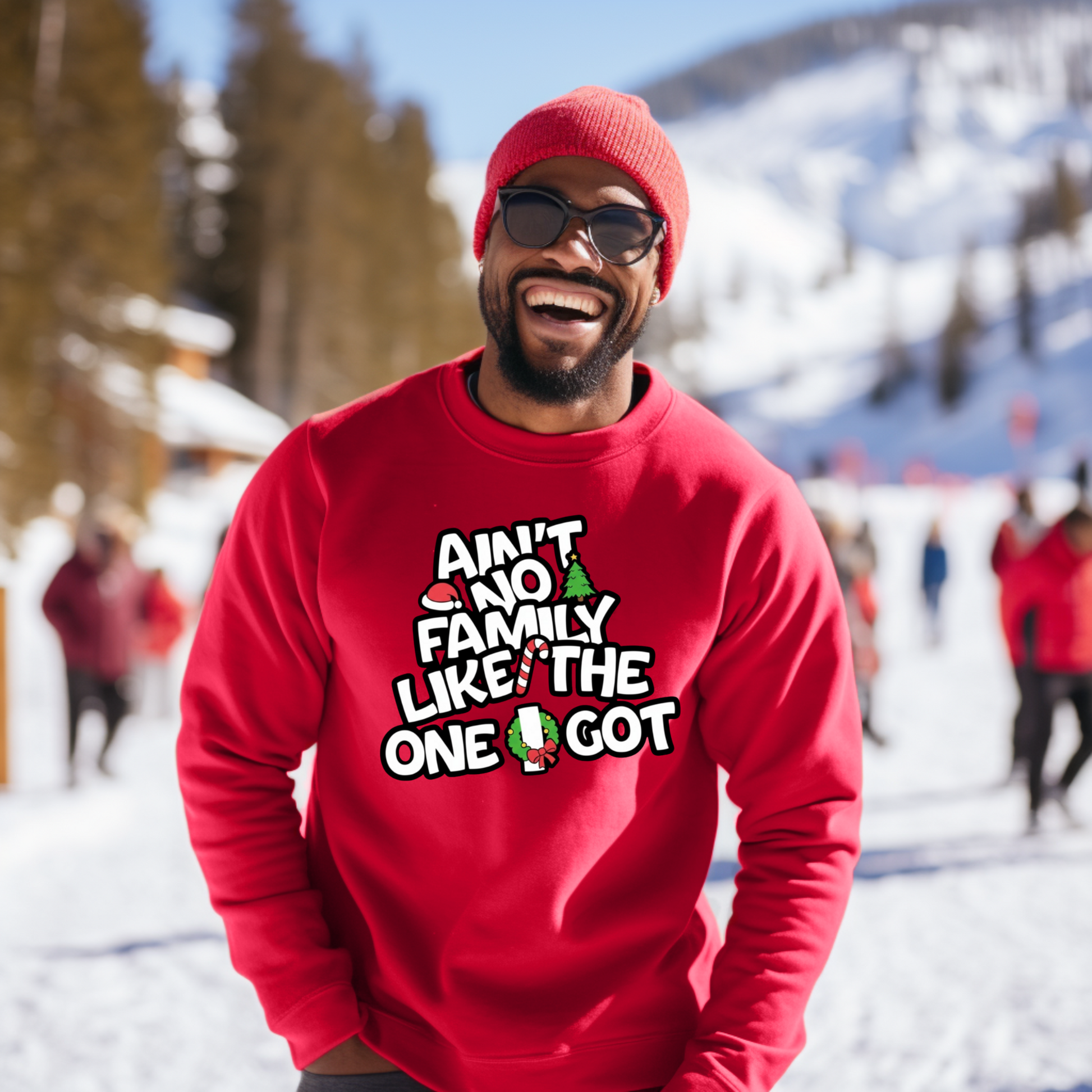 Person wearing a red sweatshirt with a humorous text design in a snowy outdoor setting