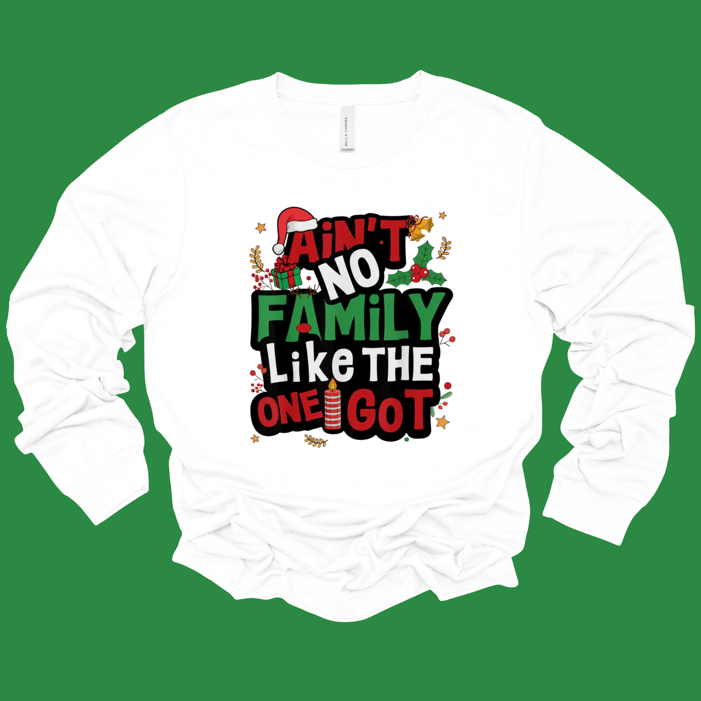 White long-sleeve shirt with colorful text design on a green background