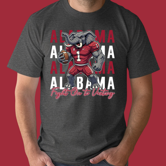 Person wearing a dark gray t-shirt with an Alabama football mascot graphic on a red background  Alabama Football T-Shirt:  "Fight on to Victory" Alabama Crimson Pride Tee