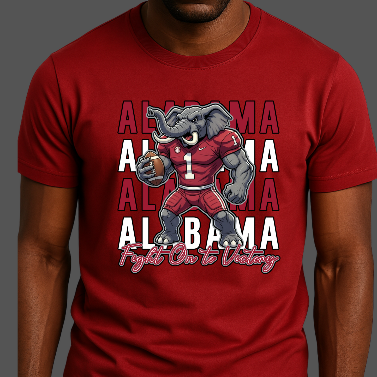 Red t-shirt with an elephant graphic and 'Alabama' text on a dark background  Alabama Football T-Shirt:  "Fight on to Victory" Alabama Crimson Pride Tee