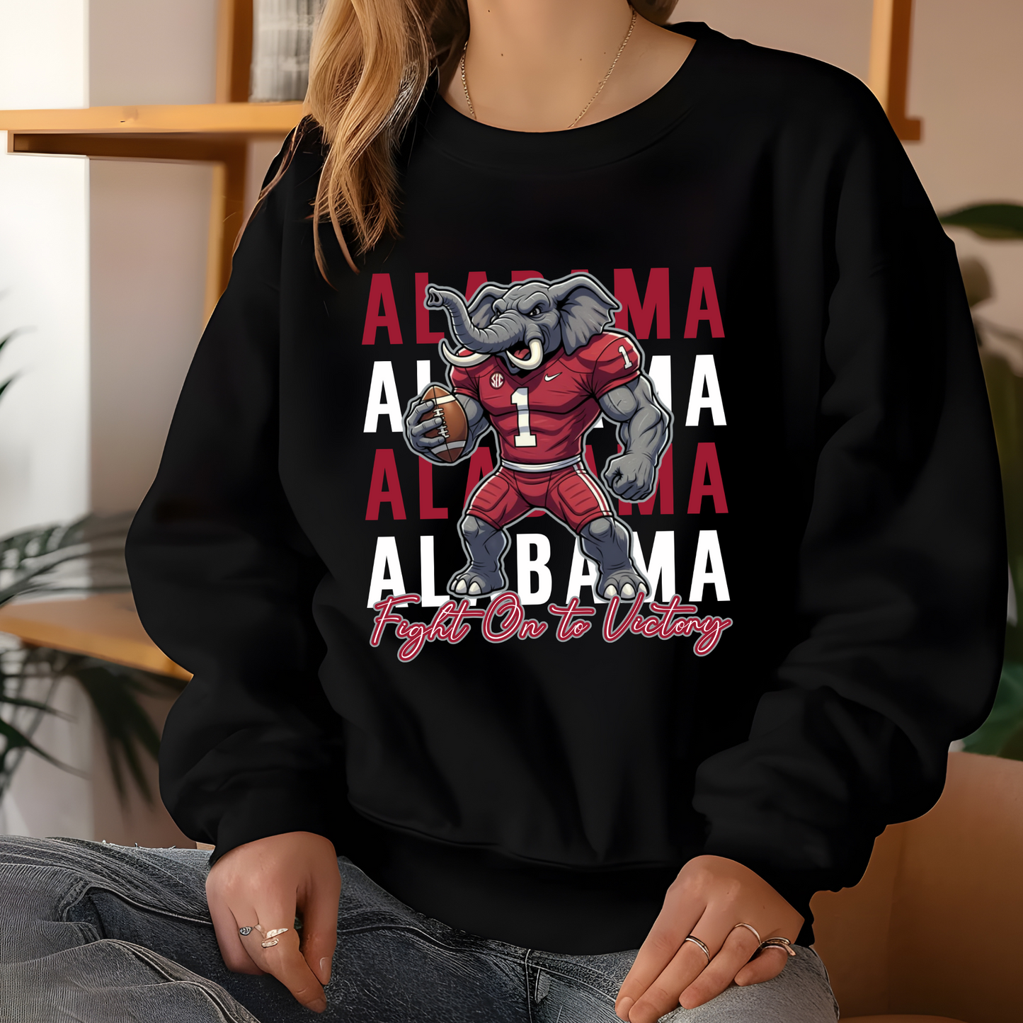 Person wearing a black sweatshirt with Alabama-themed graphics and text. Alabama Football "Fight on to Victory" Alabama Crimson Tide University Crewneck Sweatshirt