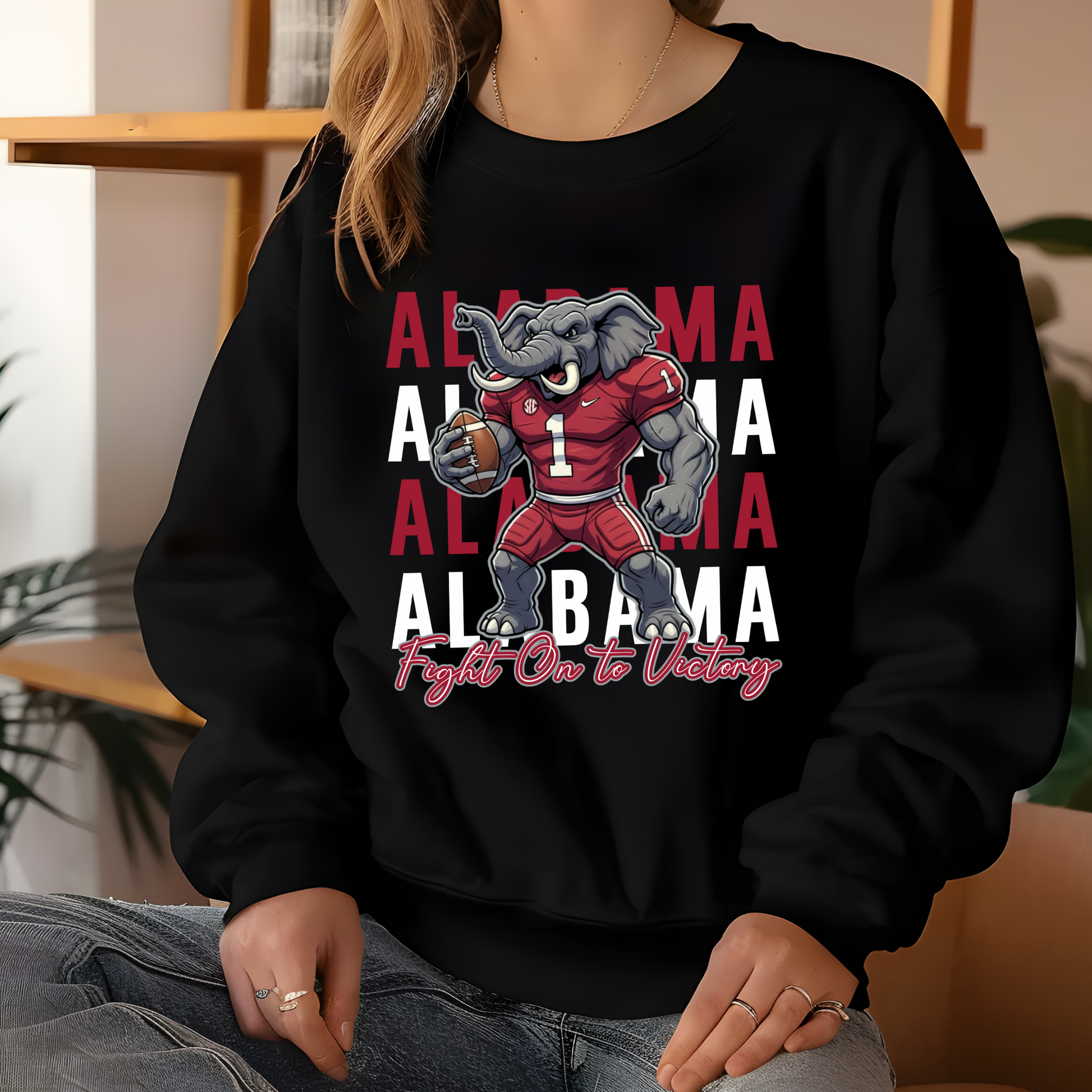 Person wearing a black sweatshirt with Alabama-themed graphics and text. Alabama Football "Fight on to Victory" Alabama Crimson Tide University Crewneck Sweatshirt