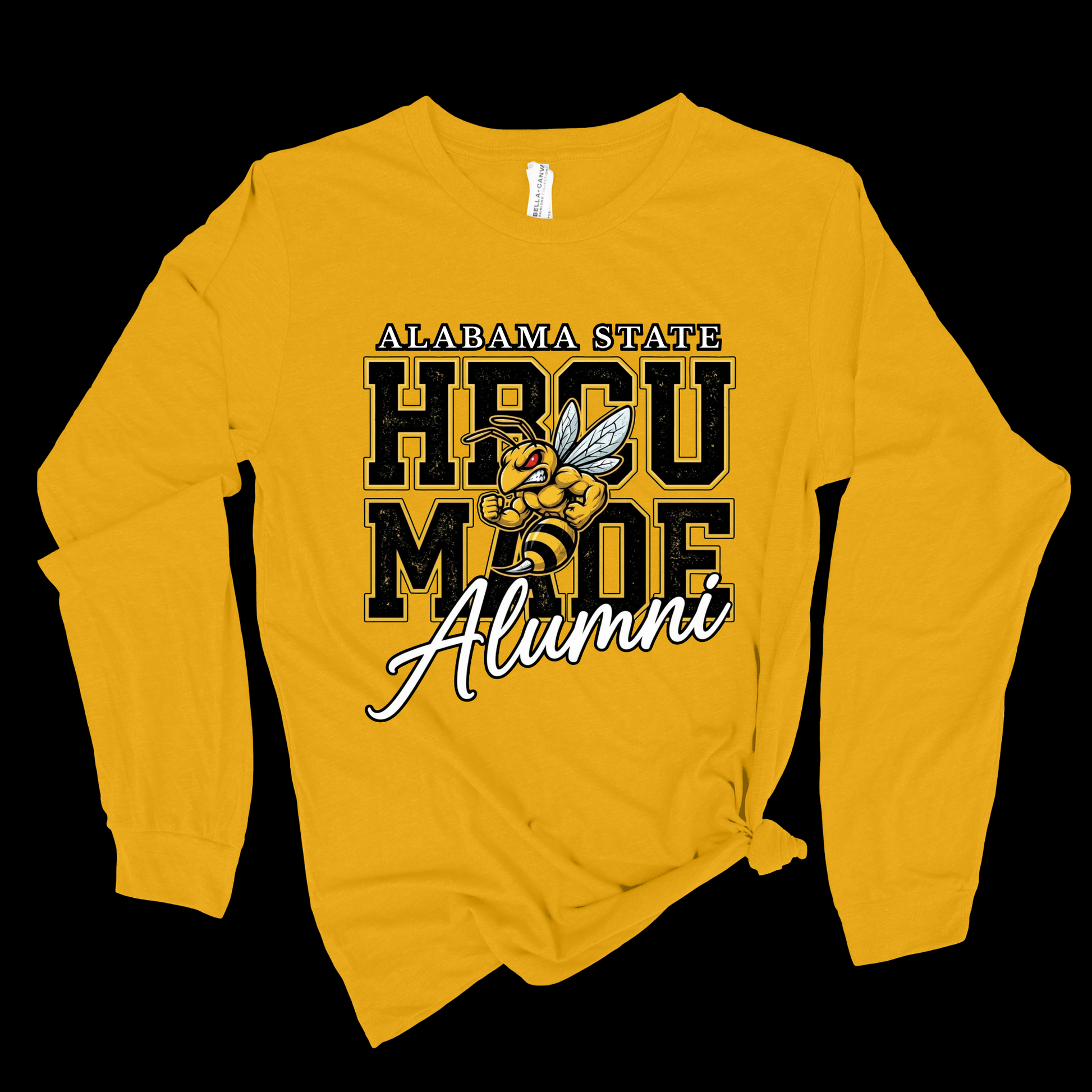 A yellow long-sleeve t-shirt with a graphic on the front that reads 'ALABAMA STATE HBCU MADE Alumni' with a wasp illustration, shown against a solid black background.