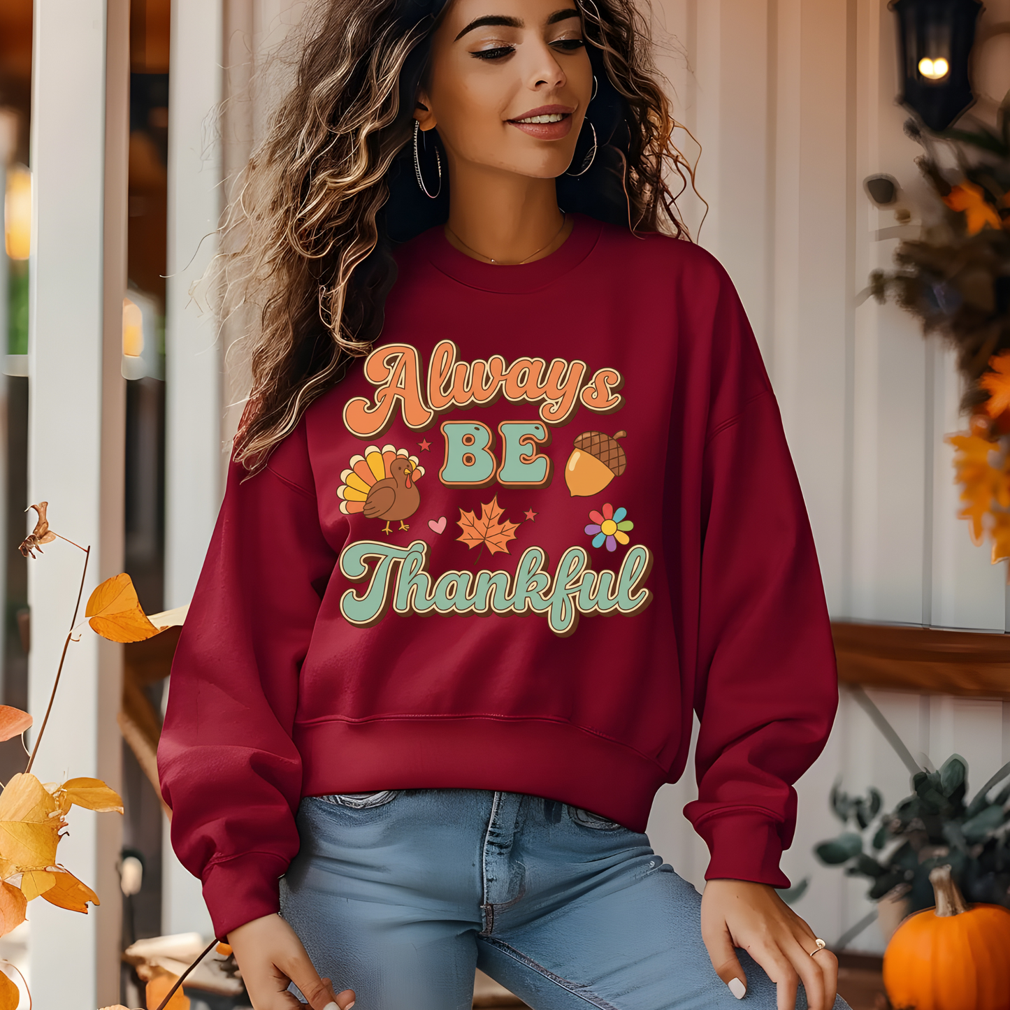 Woman wearing a red sweatshirt with 'Always Be Thankful' text and fall-themed graphics. Retro Thanksgiving Sweatshirt "Always Be Thankful" Fall Harvest Crewneck Sweater