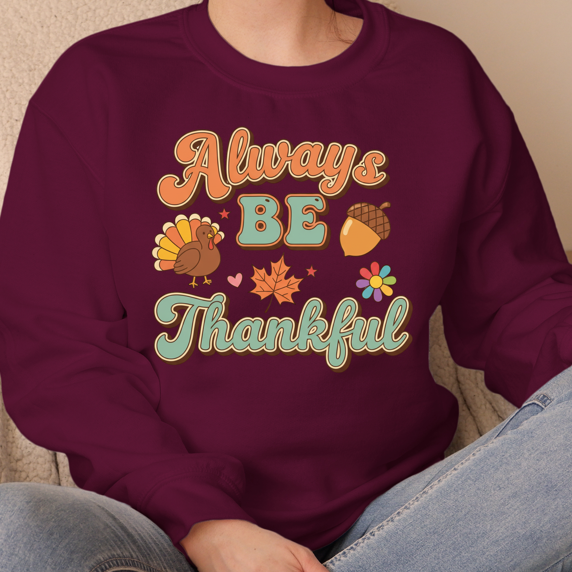 Maroon sweatshirt with 'Always Be Thankful' text and fall-themed graphics on a neutral background.  Retro Thanksgiving Sweatshirt "Always Be Thankful" Fall Harvest Crewneck Sweater
